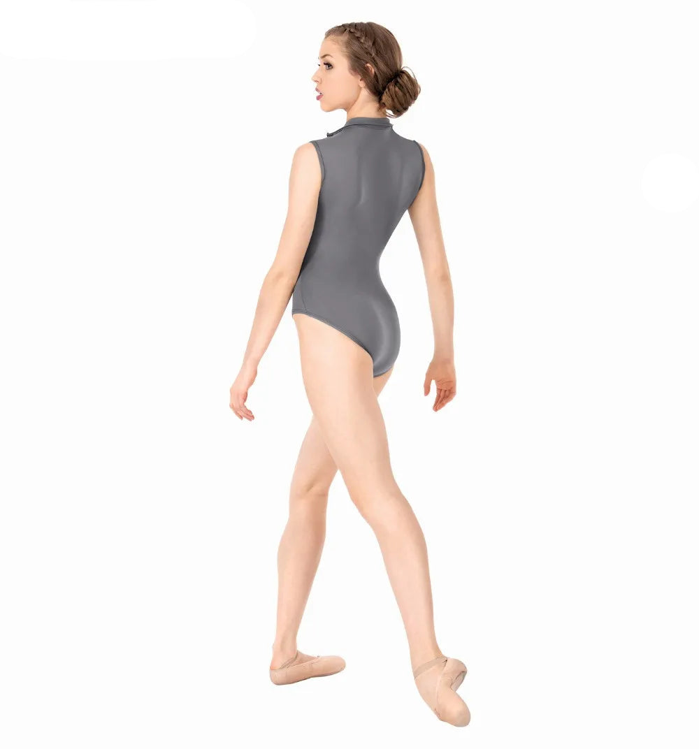 Woman wearing a gray leotard on a white background