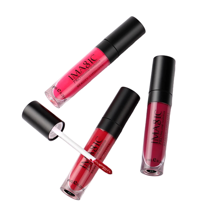 Three IMAGIC lipsticks on a marble surface