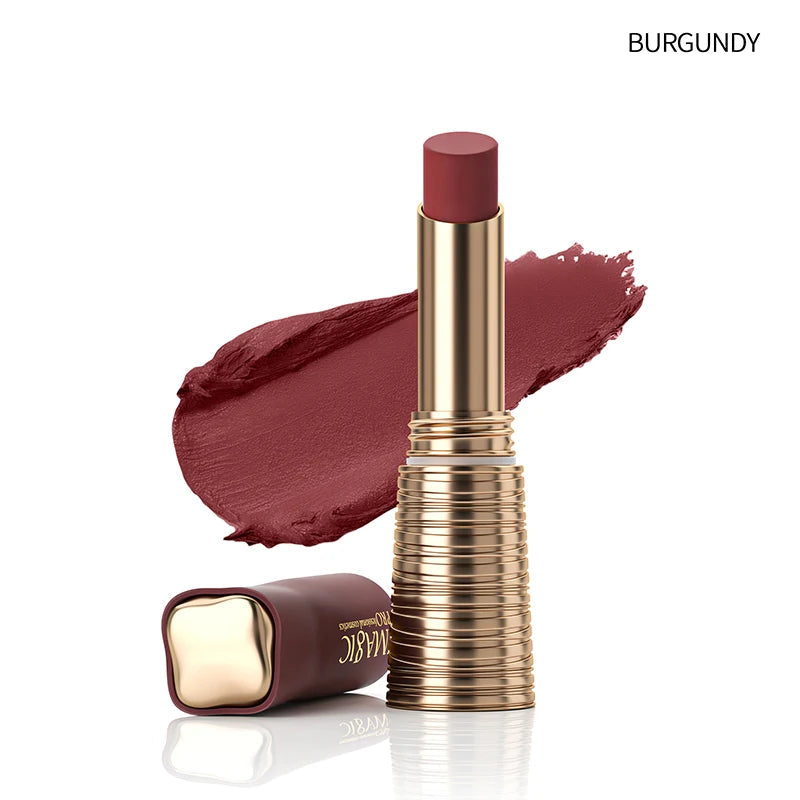 Lipstick with Burgundy shade and gold casing on a white background